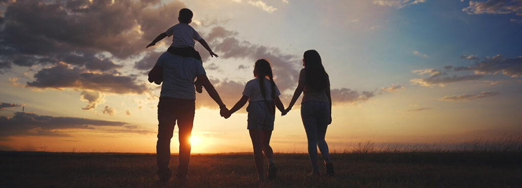 family walk at sunset