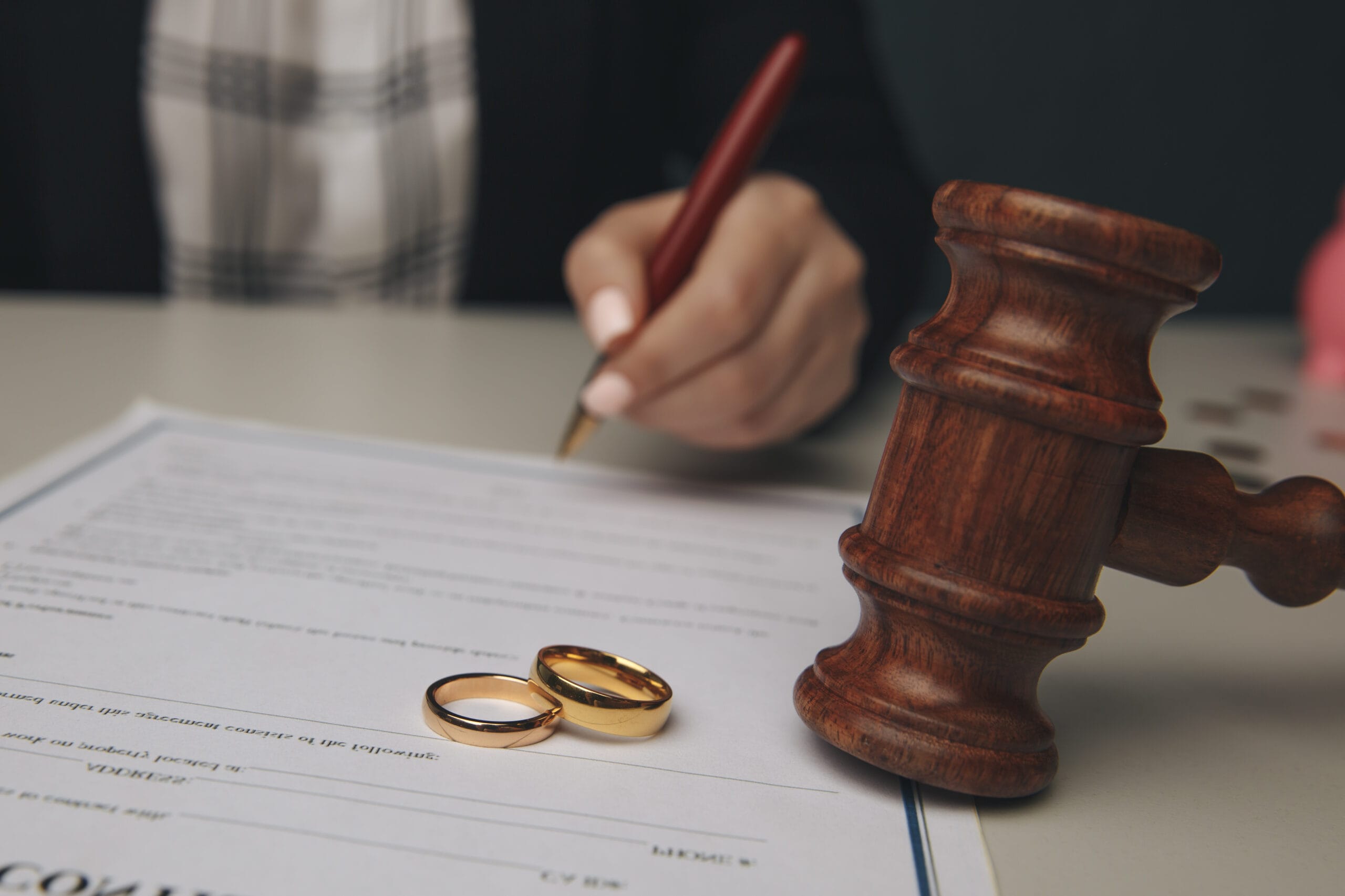 Hands,Of,Wife,,Husband,Signing,Decree,Of,Divorce,,Dissolution,,Canceling