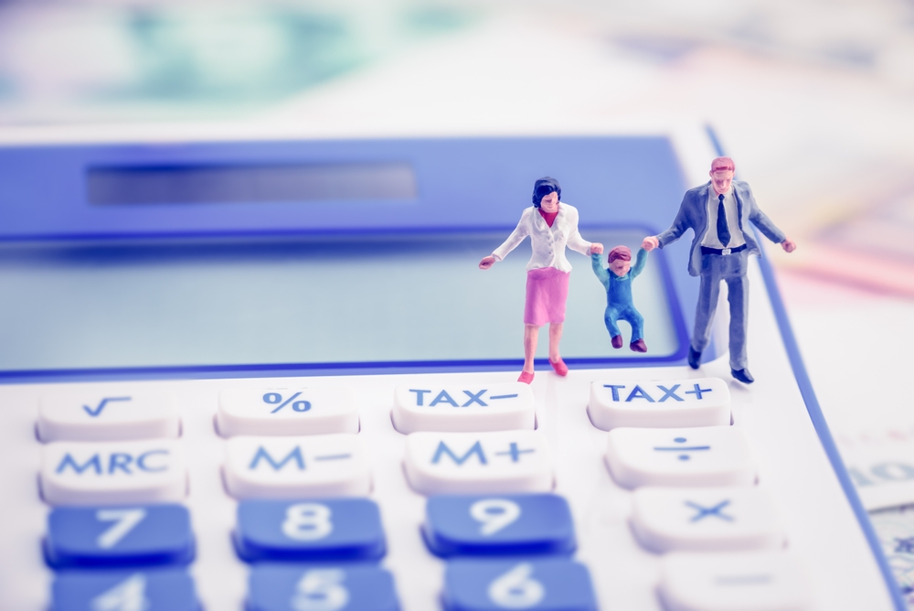 Couple organizing financial documents to prepare for divorce mediation on Long Island